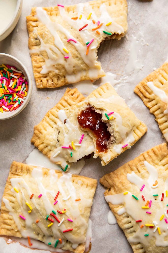 Close up of strawberry pop tart cut in half to show jam.