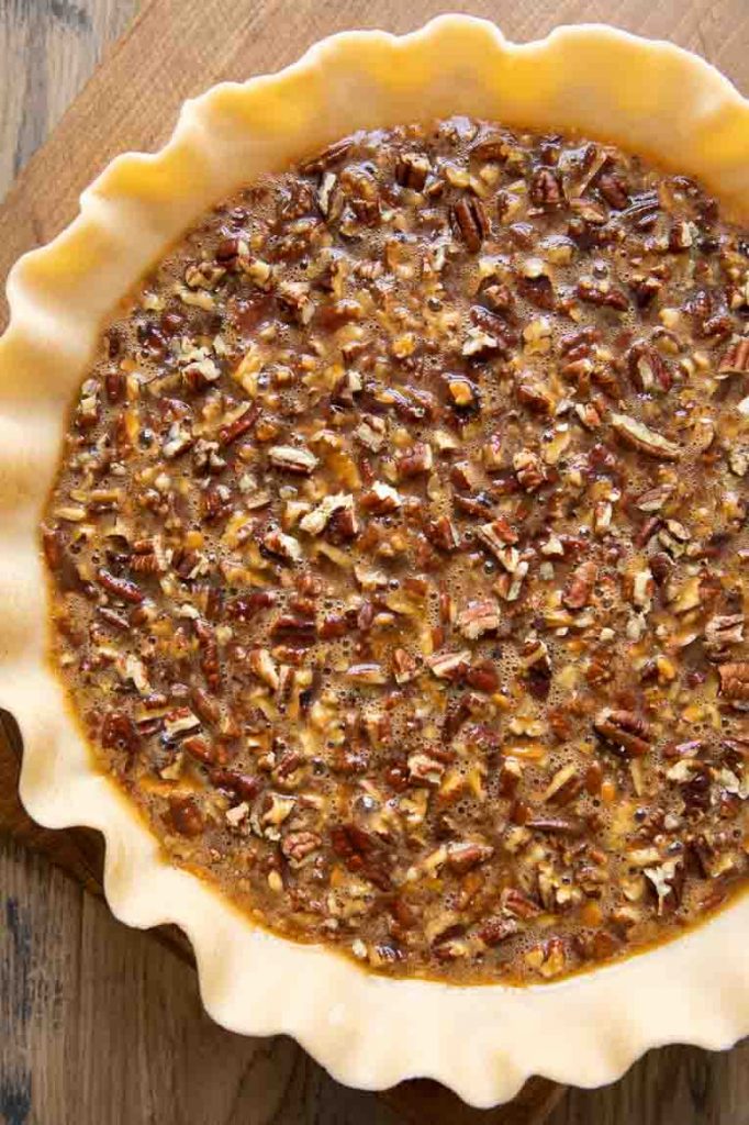Uncooked pecan pie ready to go in the oven.