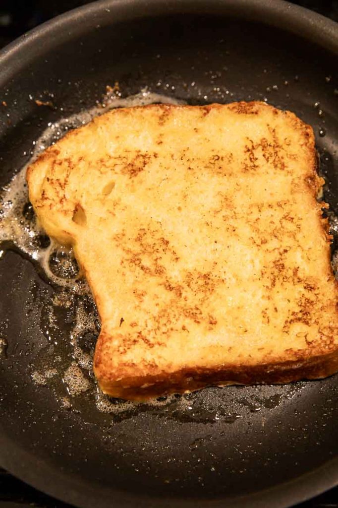 Cooking french toast on a non-stick pan.