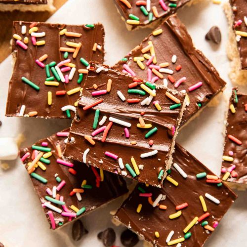 Chocolate Covered Rice Krispies Treats with dark chocolate and sprinkles.