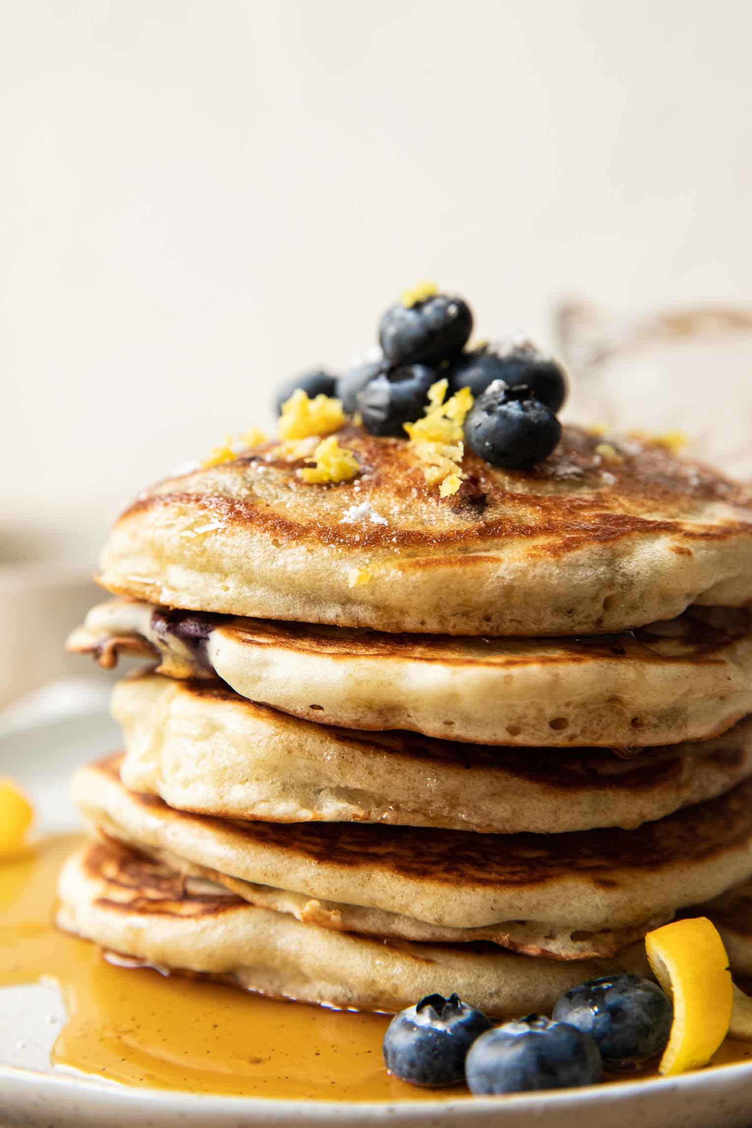 Close up of a stack of lemon blueberry pancakes.