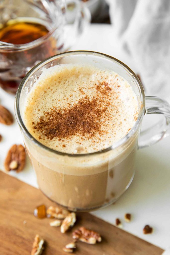 Maple Pecan Latte recipe with frothy milk and cinnamon.