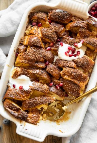 Angled photo of Brioche French Toast Casserole in baking dish.
