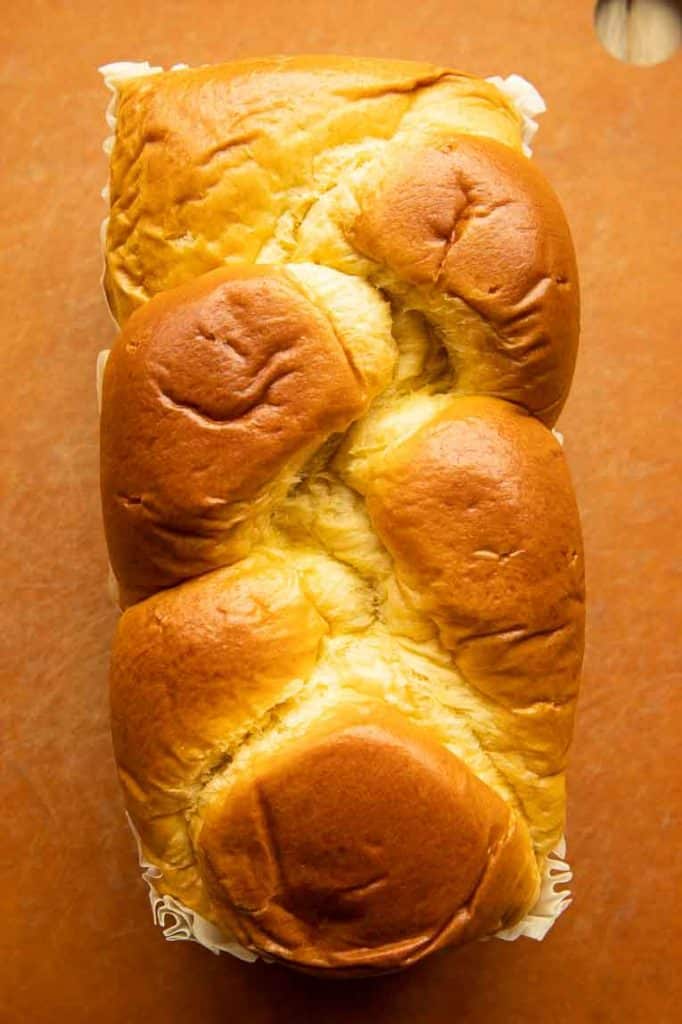 Brioche bread on a cutting board.