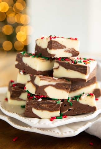 Christmas Cookie Fudge with sprinkles on a plate.