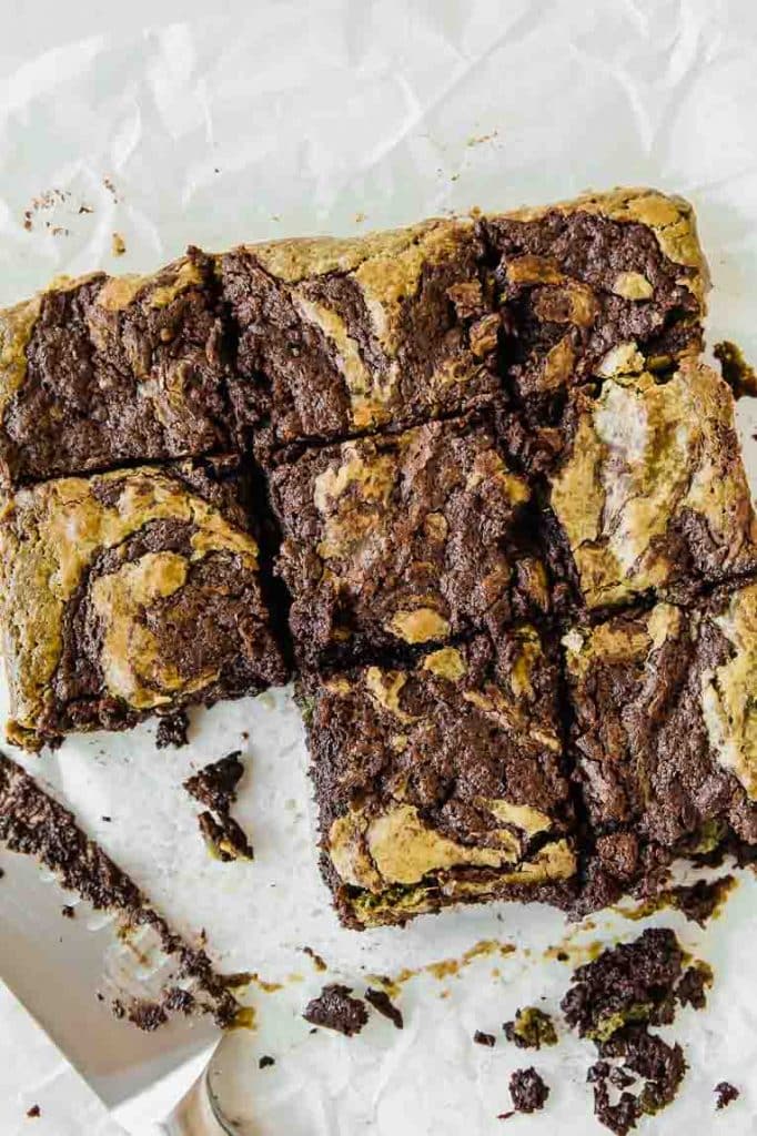 Baked matcha brownies sliced into squares.