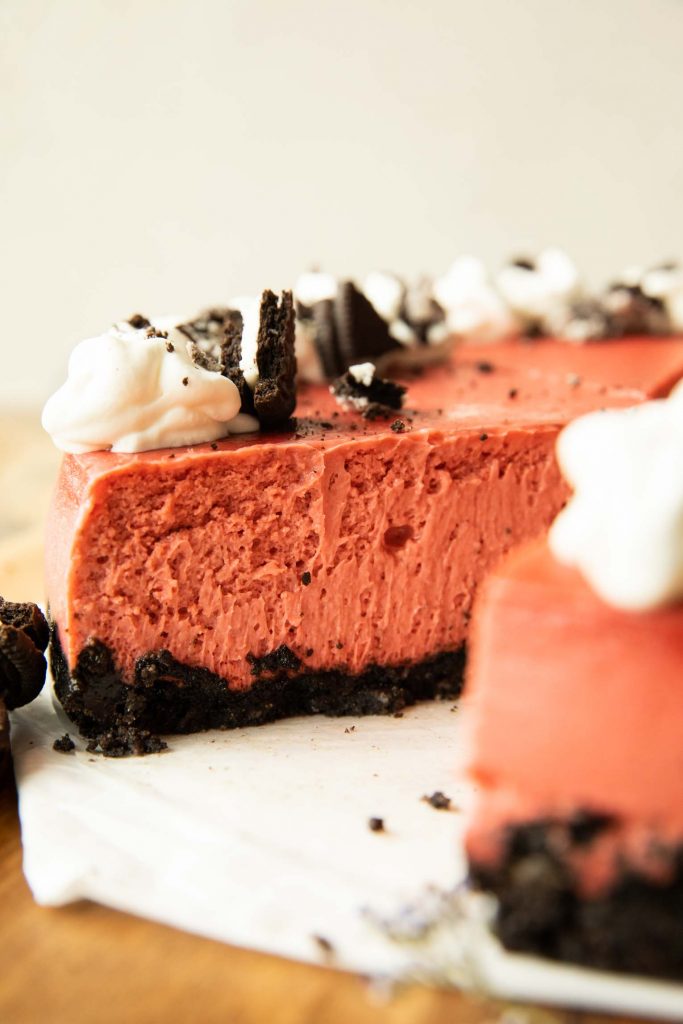 Cut across photo of sliced Red Velvet Oreo Cheesecake.