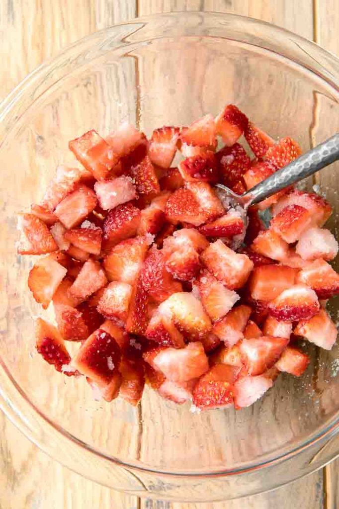 Strawberries and sugar topping in a bowl.