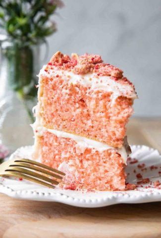Strawberry crunch cake on a white plate.