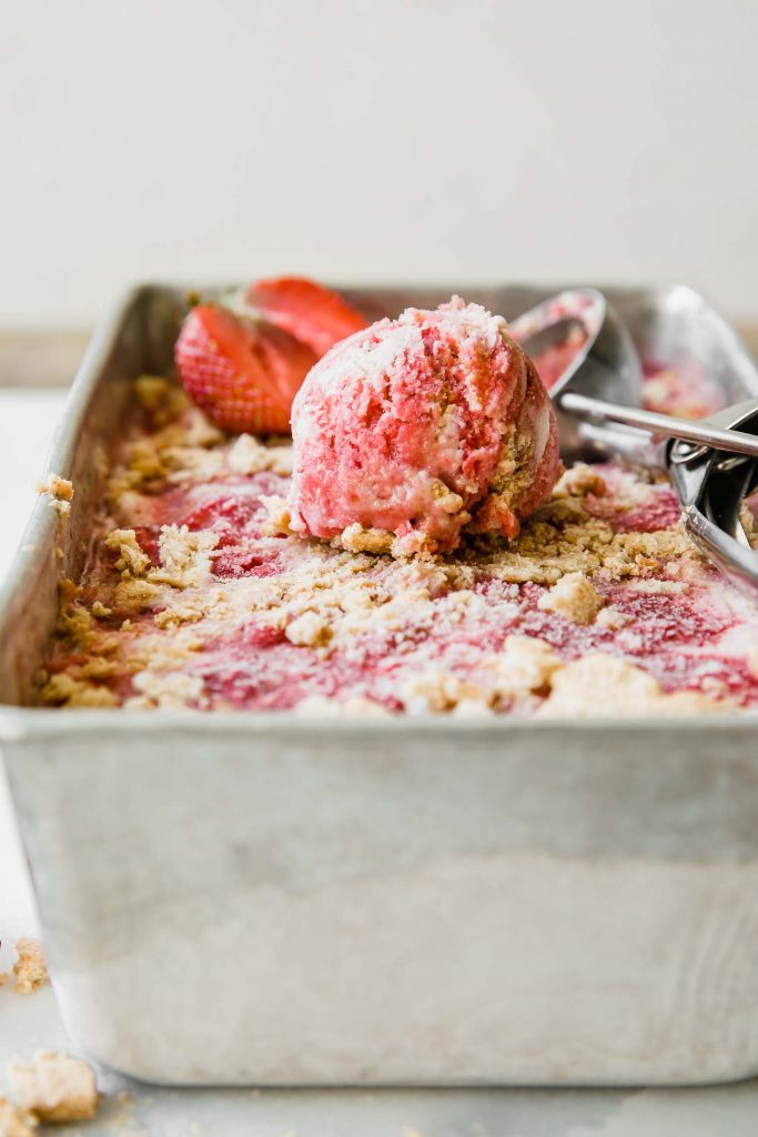 Ice cream scoop of Strawberry Cheesecake Ice Cream recipe.