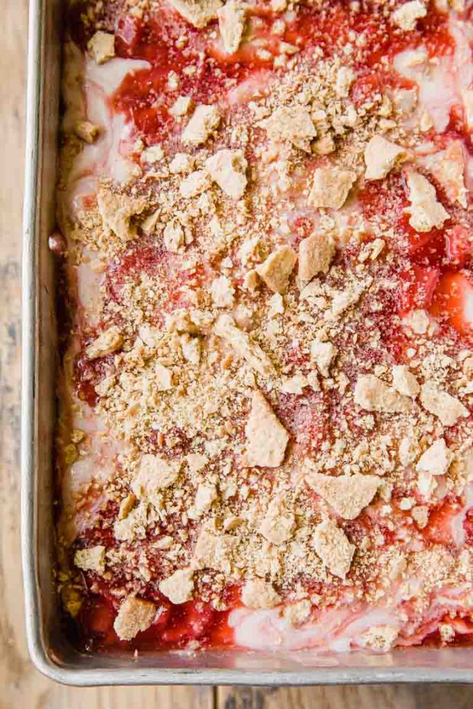 Strawberry cheesecake ice cream in a pan.
