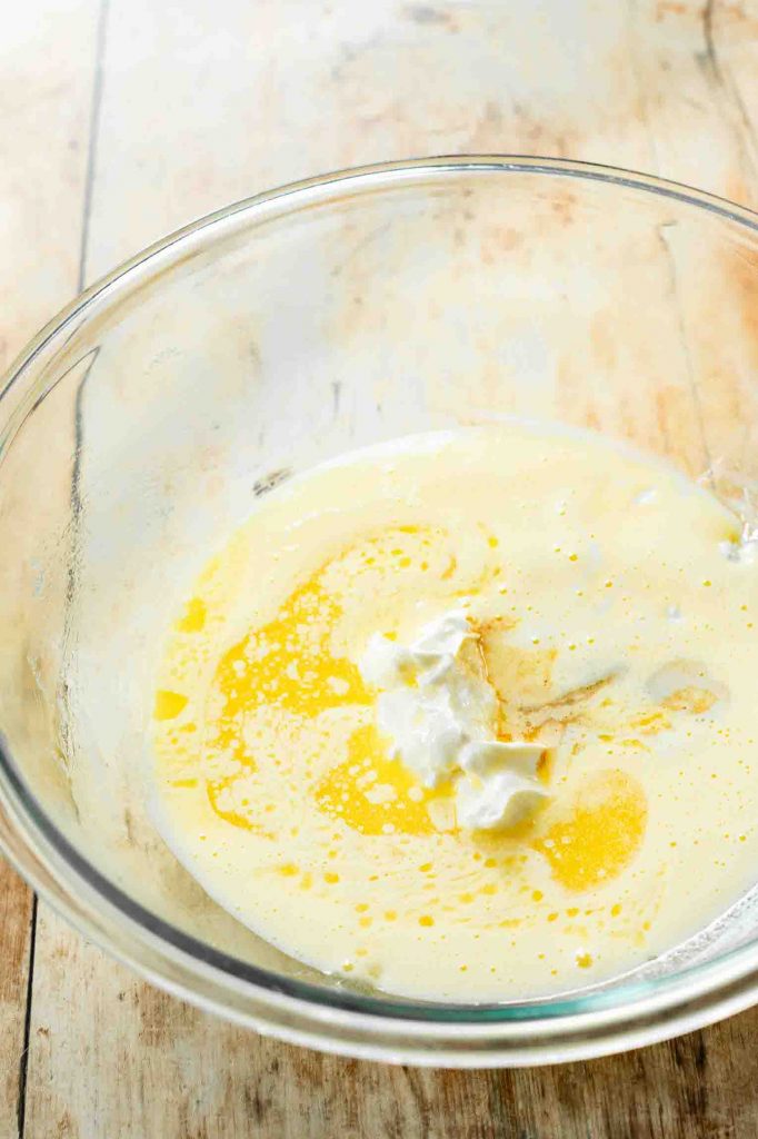 Milk, sour cream, melted butter, vanilla extract, and salt in a large mixing bowl.