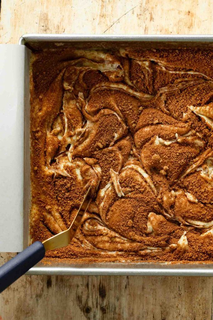 Cinnamon sugar swirled into cake batter for Snickerdoodle cake.