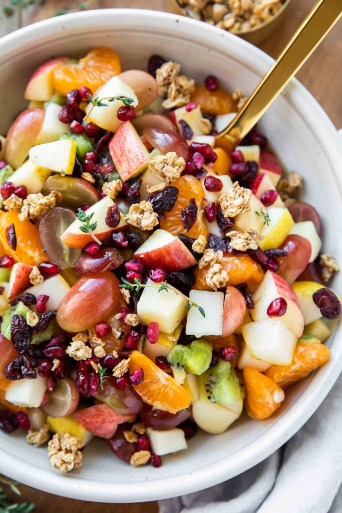 Fall fruit mixed with a cinnamon glaze for a Thanksgiving fruit salad.