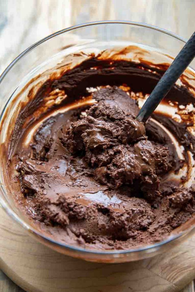 Chocolate truffle batter in a mixing bowl.