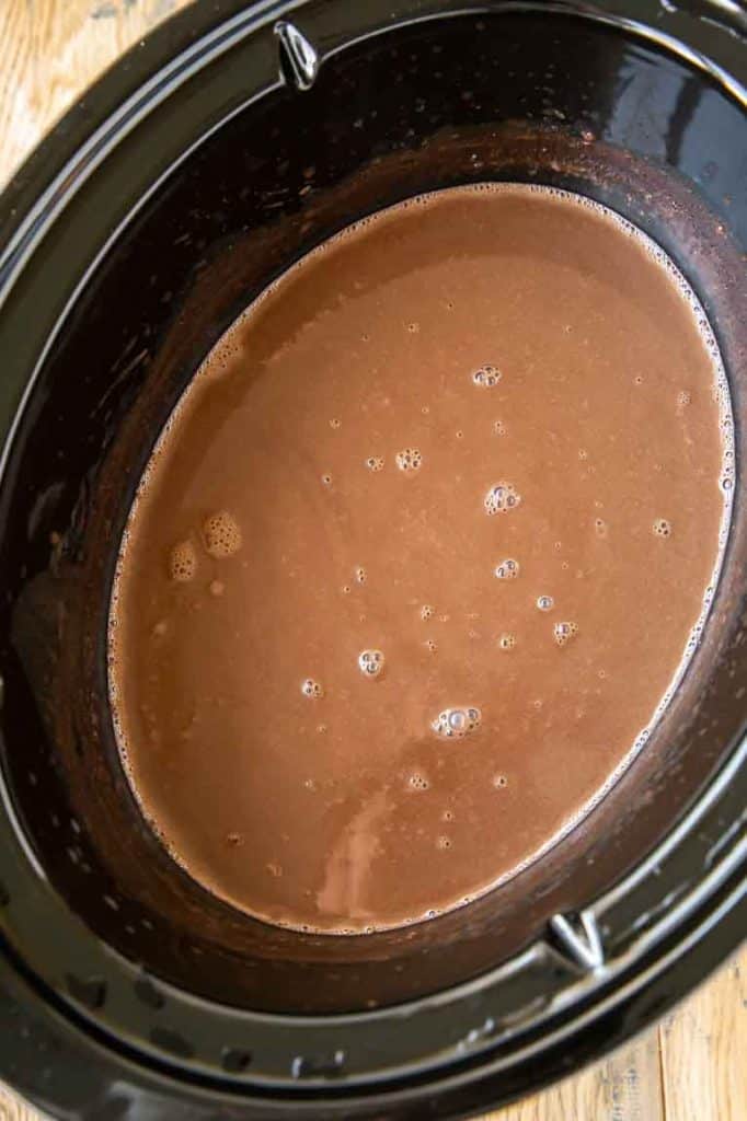 Hot chocolate mixed and cooked in a crockpot.
