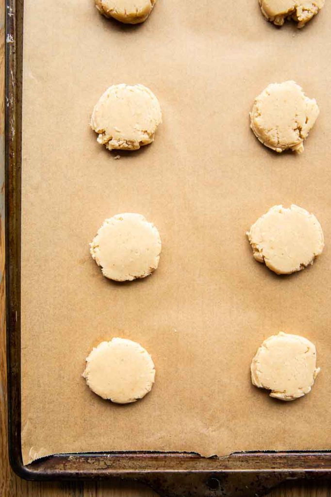 Mexican Cinnamon Cookies on a baking sheet with parchment paper.
