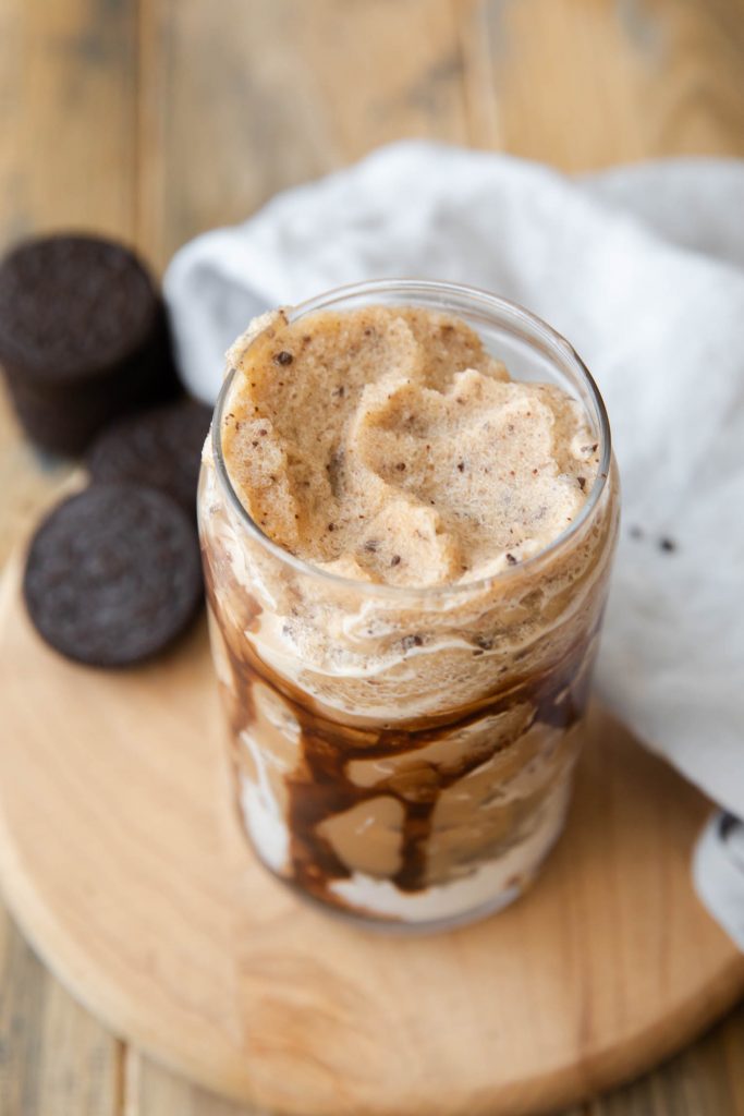 Angled view of Mocha Cookie Crumble Frappuccino in a cup.