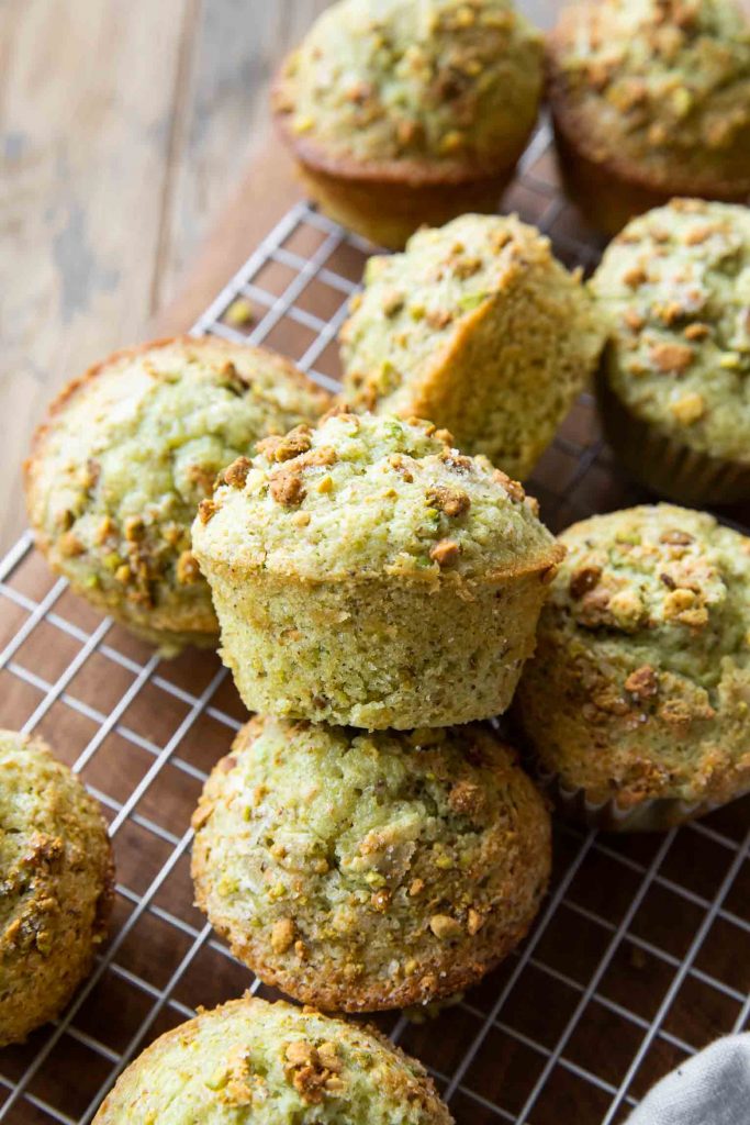 Pistachio Muffins close up on a cooling rack.