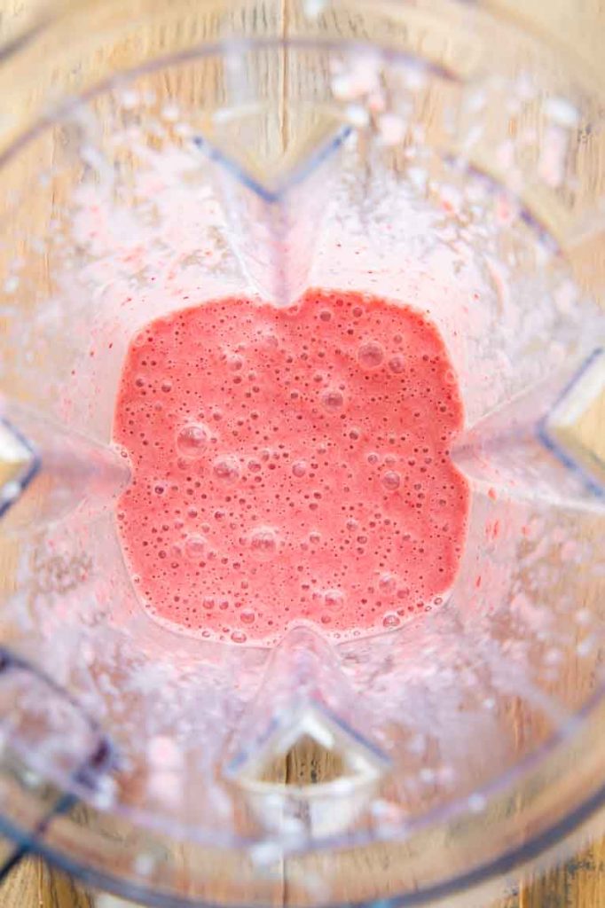 Strawberries, sugar, and milk blended together until smooth.