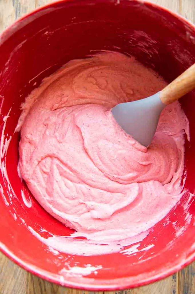 Strawberry cupcake batter in a mixing bowl.