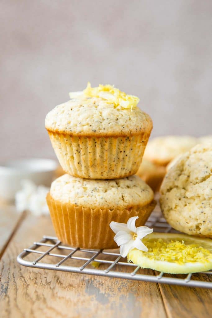 Stacked Lemon Poppy Seed Muffins with lemon slices.