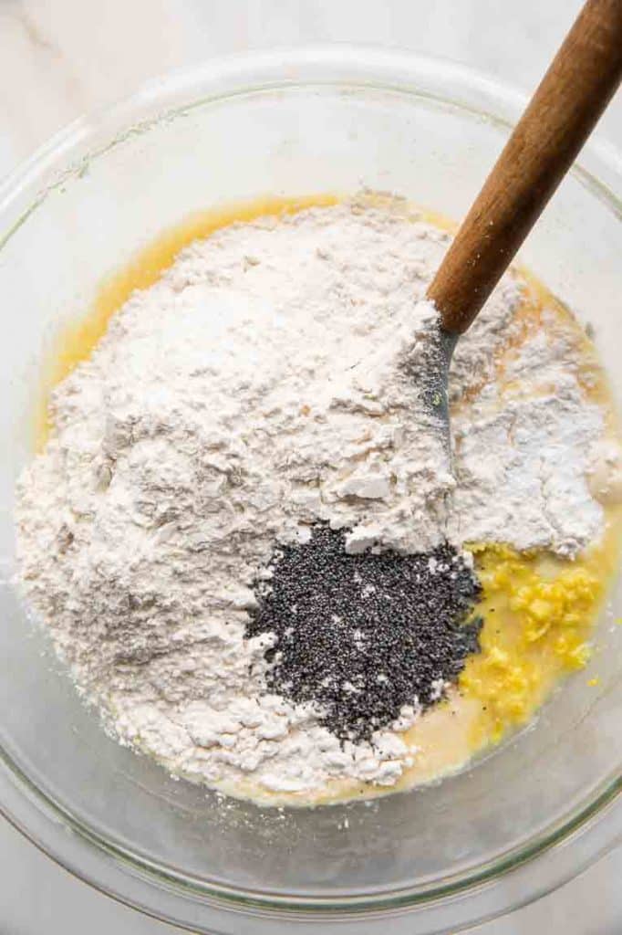 Ingredients for Lemon Poppy Seed Muffins in a large mixing bowl.