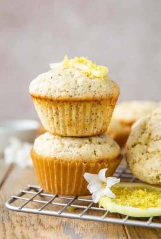 Stacked Lemon Poppy Seed Muffins with lemon slices.