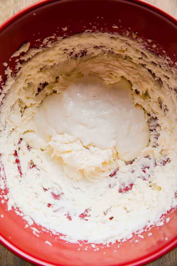Coconut cake buttercream icing being mixed.