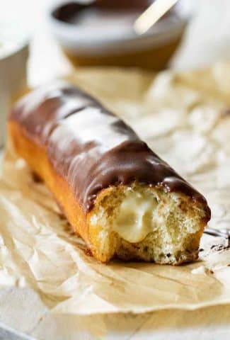 Angled photo of Long John Donuts with cream filling.