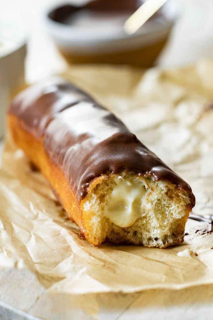 Angled photo of Long John Donuts with cream filling.