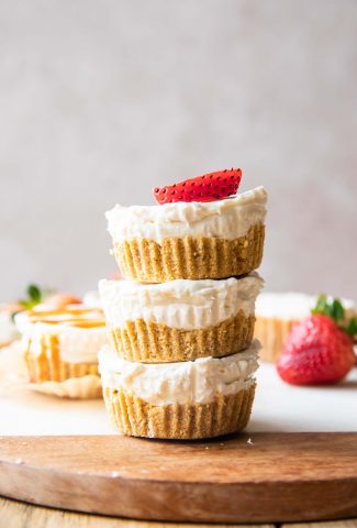Close up of No-Bake Mini Cheesecake Bites stacked on each other.