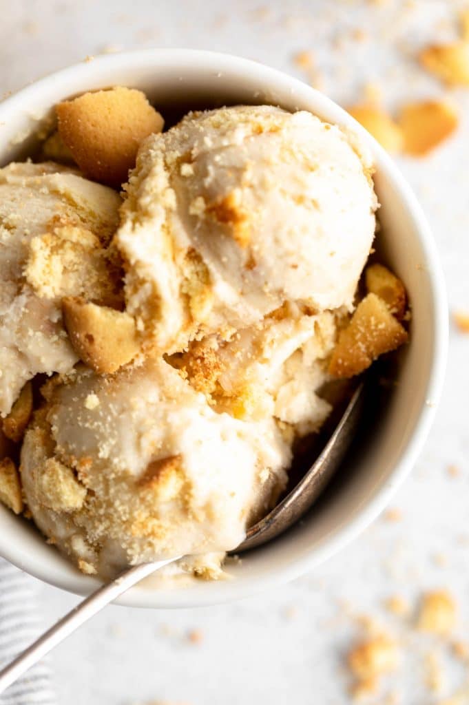 Banana Pudding Ice Cream scooped into a bowl with toppings.