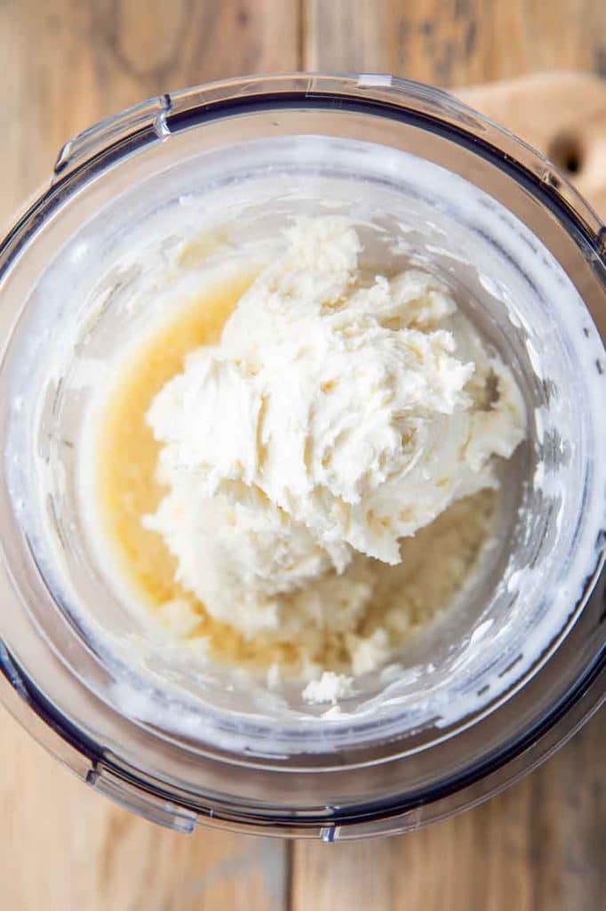 Thick creamy vanilla ice cream in pint container.