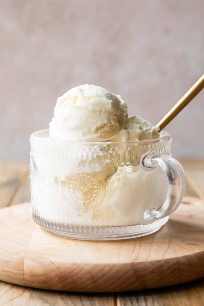 Ninja Creami Vanilla Ice Cream scooped into a parfait glass.