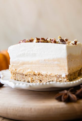 Close up of layered pumpkin dessert on a plate.