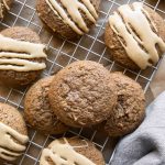 Round gingerbread cookies with latte icing.