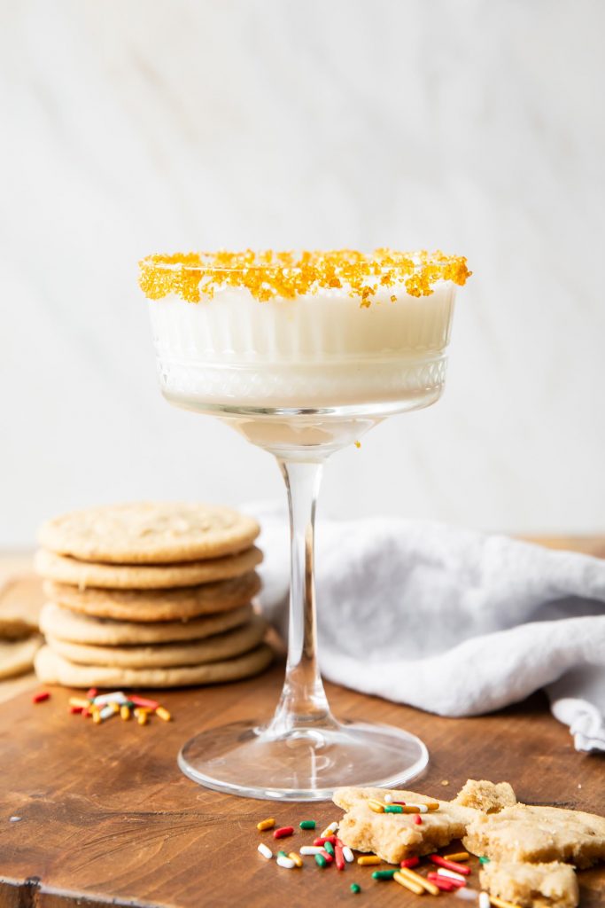 Sugar Cookie Martini with sugar cookies in the background.