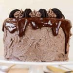 Cookies & Cream Cake layered and topped with chocolate frosting and Oreo cookies.