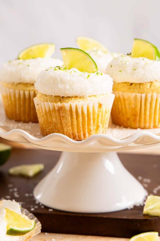 Across photo of Margarita Cupcakes on a cake stand.