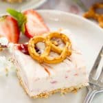 Angled photo of Strawberry Pretzel Dessert recipe on a plate.