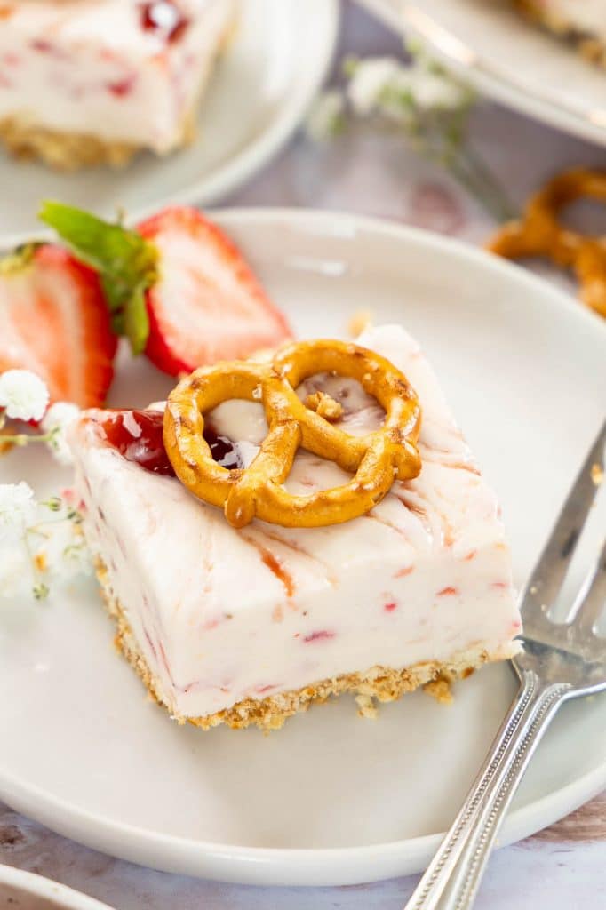 Angled photo of Strawberry Pretzel Dessert recipe on a plate.