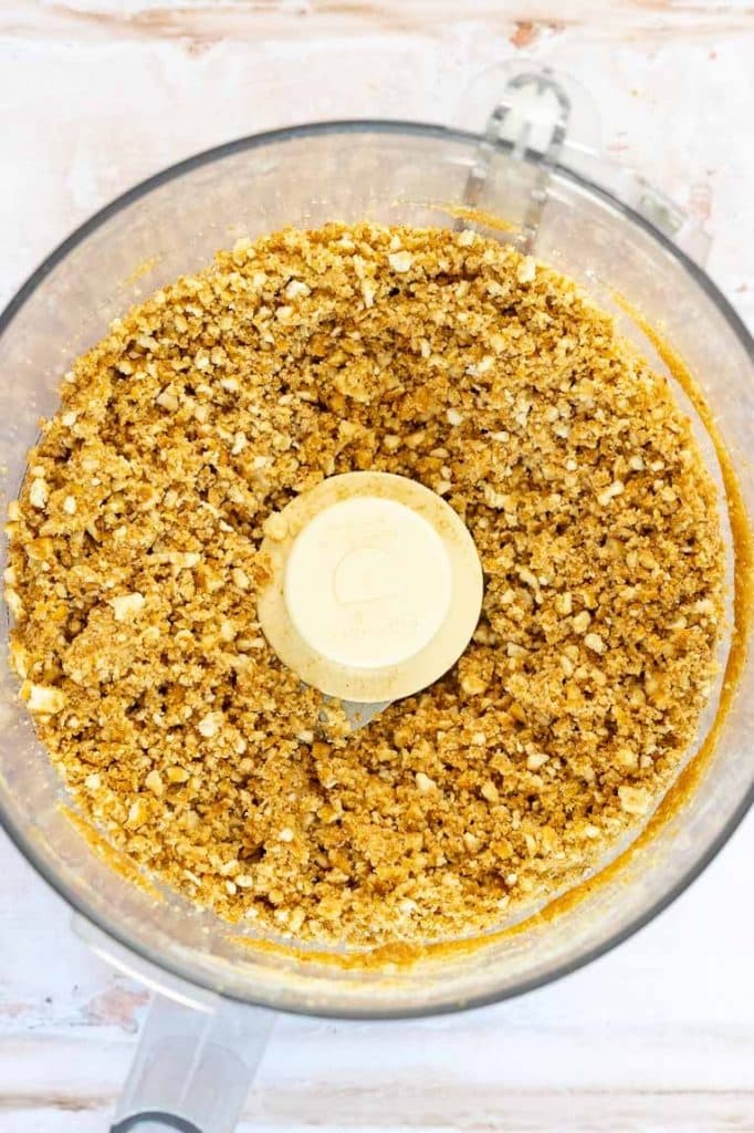 Crust being mixed in a food processor.