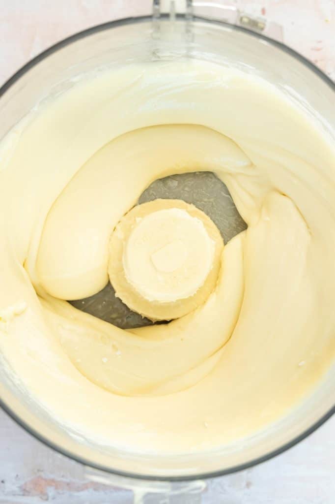 Cream cheese filling for summer strawberry dessert being mixed.