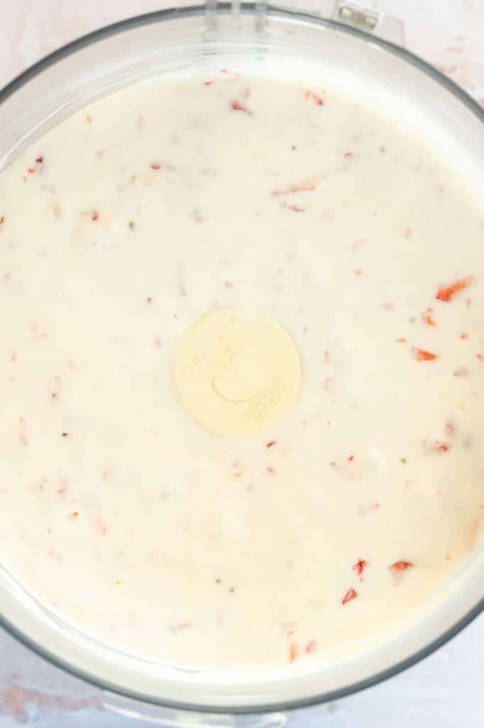 Strawberries added to filling for Strawberry Pretzel Dessert.