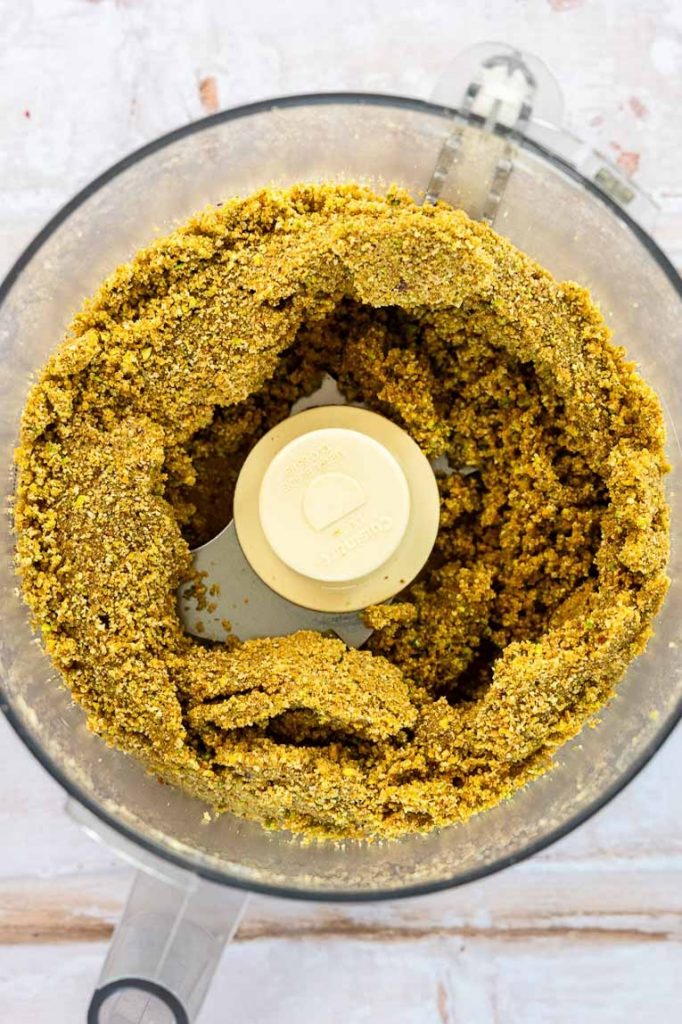 Pistachio graham cracker crust being blended.