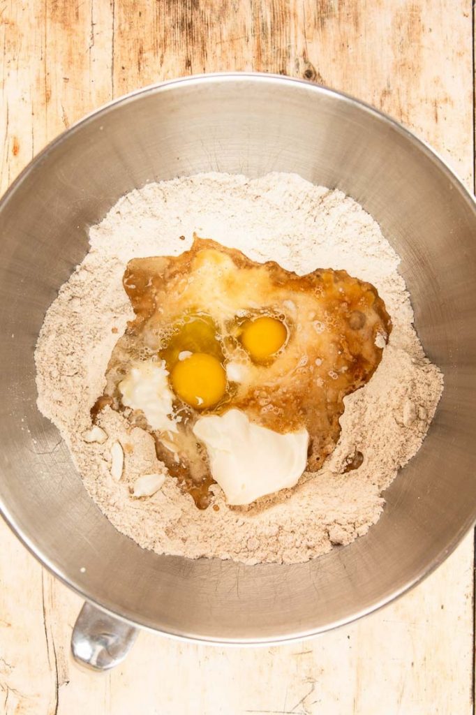 Cake donut ingredients in a bowl.