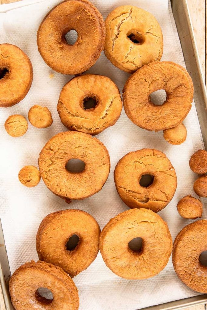 Cake donuts on a baking sheet.