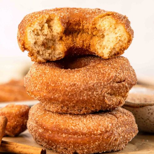 Cake donuts stacked on top of each other.
