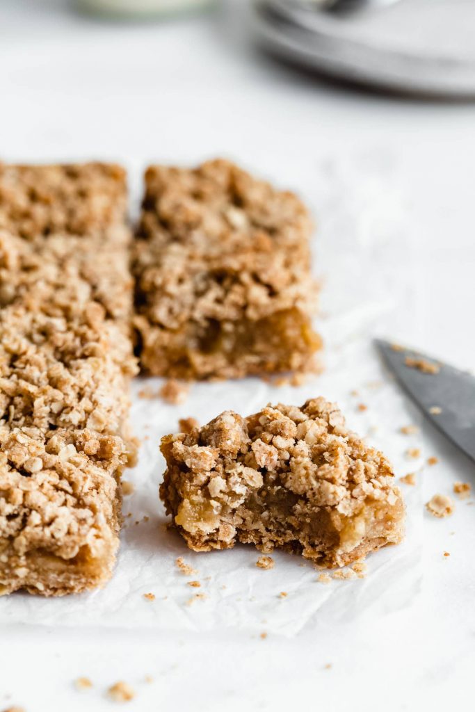 Apple Pie Bars on parchment paper.